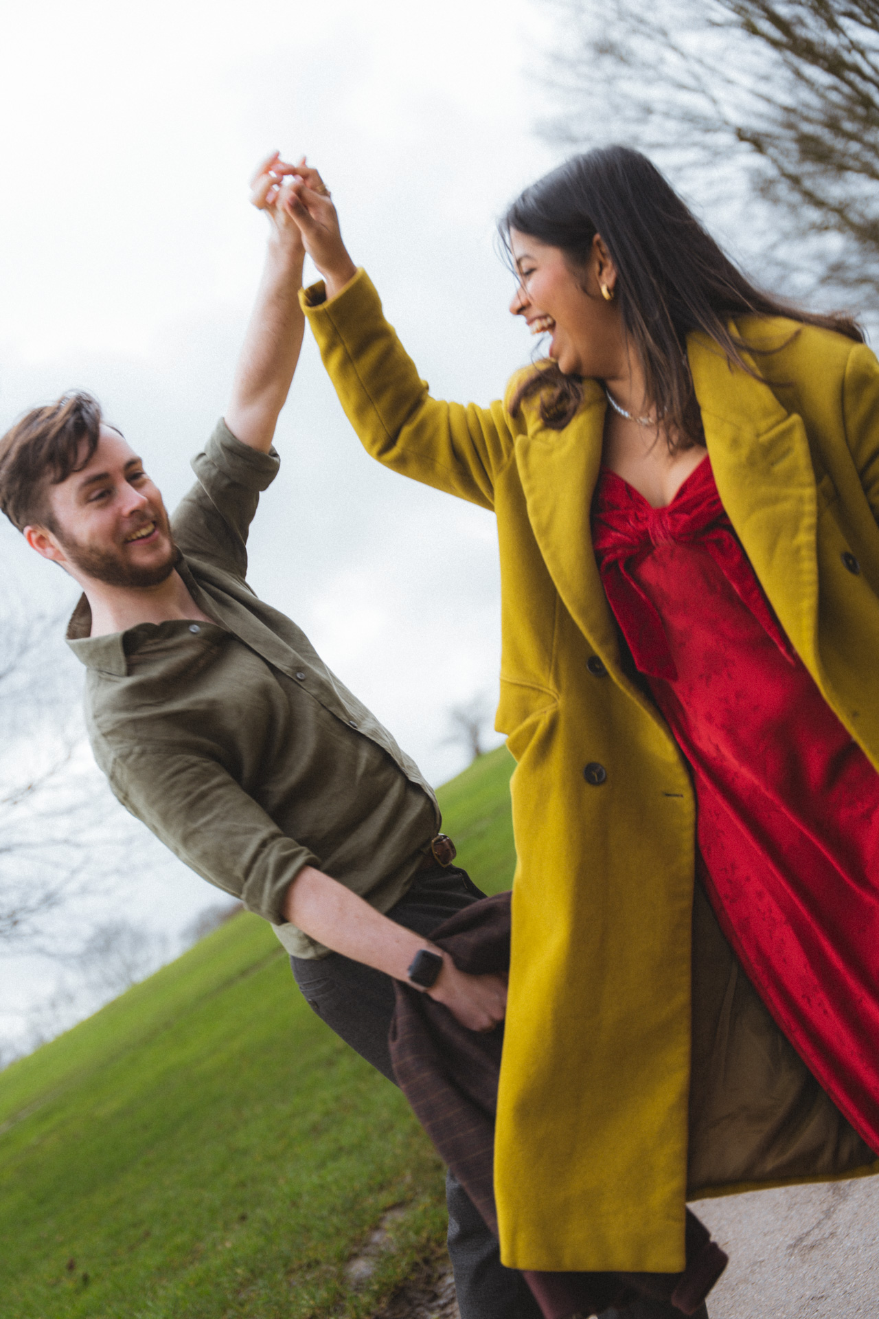 Couple laughing together on a London hillside