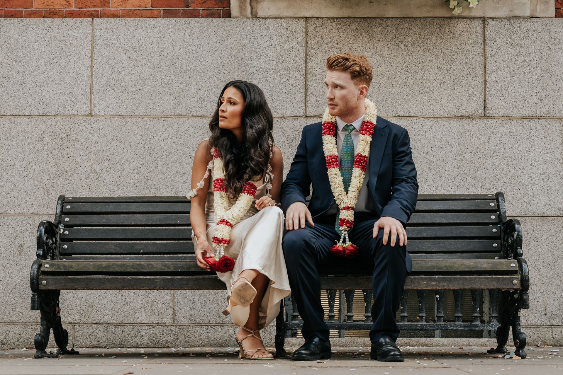 Couple with floral garlands, London wedding